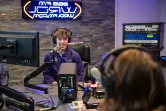 photo of students on air at WRDL radio station